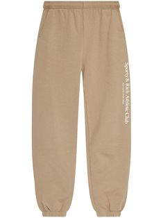 beige cotton jersey fleece elasticated waistband two side slash pockets logo print at the leg rear patch pocket elasticated cuffs Sporty And Rich, Wall Street, Active Wear For Women, Logo Print, Track Pants, The Wall, Patch Pocket, Active Wear, Track