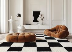 an elegant living room with black and white checkerboard rugs on the floor