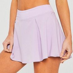 Purple Skort With Built-in Shorts, Solid Mini Skort For Sports, Solid Color Mini Skort For Sports, Workout Mini Skort With Pleated Skirt, Solid Color Pleated Skort For Sports, Solid Sports Skort With Lined Skirt, Solid Skirted Tennis Skort, Lined Tennis Skort, Tennis Skort In Solid Color