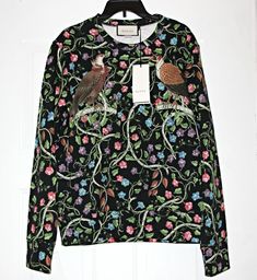 Animals continue to inspire Gucci this season; embodying the brand’s quirky spirit this sweatshirt is adorned with birds  and winding vines. Expertly crafted in Italy, the slightly loose fit ensures that it will wear well with jeans and sneakers.  The sweatshirt has become a core design of Gucci's latest collections.  For Gucci's Cruise collection, the basic sweatshirt has been re-worked in felted cotton jersey with an allover print  featuring various birds of prey set against a floral and vine motif.   This multi-colored Gucci 'Birds of Prey' cotton sweatshirt will be the pick of the bunch in your tops department.  After all, this vibrant sweatshirt was created by Michele and he clearly has a knack for making desirable garms.  Crafted from felted cotton jersey, this jumper features a crew Core Design, Cruise Collection, Basic Sweatshirt, Birds Of Prey, Multi Colored, Printed Cotton, Sweater Outfits, Vines, Jumper