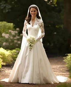 a woman in a wedding dress standing on a path