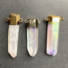 "Listing is for one Angel Aura crystal quartz Point Pendant Connector Stone Size: approx. 13-15mm x 47-55mm Can choose just pendant or pendant with chain necklace Drill Hole: drilled STOCK PHOTOS-- Pendants will vary slightly as to the shape and size of crystal Quartz, making each ring unique. Quartz is a power stone. It has been called the \"Universal Crystal\" because of its many uses. It enhances energy by absorbing, storing, amplifying, balancing, focusing and transmitting." Iridescent Gemstone Pendant Crystal Necklace, Iridescent Crystal Pendant For Jewelry Making, Iridescent Crystal Pendant Necklace For Jewelry Making, Gold Mineral Crystal For Jewelry Making, Angel Aura Crystal, Kindle Cover, Power Stone, Aura Crystals, Photo Pendant