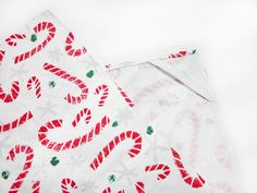 two napkins with candy cane designs on them