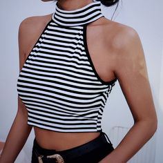 Casual Striped Halter Slim Fit Polyester Casual Striped Halter Top For Summer, Striped Tops For Summer Nights Out, Fitted Black And White Tops For Day Out, Fitted Black And White Top For Spring, Fitted Black And White Tops For Summer, Fitted Black And White Tops For Party, Black And White Fitted Tops For Summer, Black And White Summer Tops, Sporty Halter Top With Bra-friendly Racerback