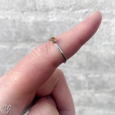 A handmade hammered sterling silver ring with a 4mm Citrine cabochon. Citrine is November's birthstone. Available in sizes 3 through 14, oxidized or bright silver.  - Handmade - Sterling Silver - Size 3 through 14 - Oxidized or bright silver - Citrine Please read my policies before buying: https://www.etsy.com/shop/Draadjuwelen/policy?ref=shopinfo_policies_leftnav Take a look at my other sterling silver rings: https://www.etsy.com/nl/shop/Draadjuwelen?section_id=13764110&ref=shopsection_leftnav_ Dainty Jewelry Rings, Yellow Gemstone Ring, Stackable Birthstone Rings, Initial Earrings Studs, Bridesmaid Rings, Friendship Ring, Stackable Rings Silver, Casual Rings, Tiny Rings