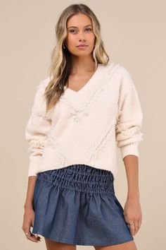 From the slopes to the streets, wintertime is sweeter with the Lulus Trendy Warmth Cream Fringe V-Neck Pullover Sweater! Soft and stretchy medium-gauge knit shapes this cozy sweater that has long sleeves with drop shoulders and a V-neckline. Boxy bodice boasts matching ""V"" bands of textured fringe trim. Ribbed knit accents the neckline, cuffs, and slightly cropped hem. Fit: This garment fits true to size. Length: Size medium measures 19.5" from shoulder to hem. Inseam: 0.00 Front Rise: 0.00 Bu Textured Fringe, Sweaters Fall, White Crochet Top, Cozy Sweater, Fringe Trim, White Crochet, Fall Sweaters, Cozy Sweaters, The Streets