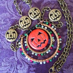 Super Festive Fall/Halloween Pumpkin Charm Necklace. Brass Chain With Pumpkin Accents! Focal Point Charm Is An Orange Pumpkin Face With Colorful Seed Beads Accents. Unique Necklace, You Won't See Anyone Else Wearing This! 59 Metal Necklaces With Lobster Clasp For Halloween, Metal Necklace With Lobster Clasp For Halloween, Halloween Metal Necklace With Adjustable Chain, Nickel-free Halloween Party Necklace, Nickel-free Metal Necklace For Halloween, Spooky Red Halloween Jewelry, Bohemian Jewelry For Halloween Party, Bohemian Halloween Party Jewelry, Metal Jewelry For Halloween Festival