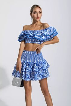 A must for any wardrobe looking youthful is our Dorothy Blue Floral Ruffle Off-Shoulder Set. You'll receive compliments from everyone wearing this set. The printed fabric is structured in layers and trimmed with ruching. The cropped top is paired with a high-waisted cake skirt. Whether you're on vacation or on the go, this set is the perfect fit for you.Top Length: Approx 20cmSkirt Length: Approx 40cmMaterials: PolyesterGentle Dry Clean OnlyModel is 5 ft 74 and wears size SColour may vary due Glitter Wedding Dress, As You Like It, Cake Skirt, Europe Outfits, Bandage Midi Dress, Skirt And Top Set, Floral Shirt Dress, Puff Sleeve Dresses, Maxi Knit Dress