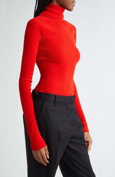 A tall turtleneck is tastefully split at the back on this ribbed top designed in a longline silhouette with mirror-image monogram hardware at the hem. 23" length (size X-Small) Turtleneck Long sleeves 100% viscose Dry clean Imported Designer Clothing Elegant Fitted Turtleneck With Ribbed Neckline, Modern Fitted Turtleneck For Workwear, Red Turtleneck Workwear Top, Red Fitted Fine Knit Top, Red Fine Knit Fitted Top, Red Turtleneck Tops For Work, Red Ribbed Turtleneck Top, Fitted Fine Knit Mock Neck Top, Fox Top