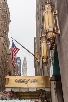 a street sign that is hanging from the side of a building in new york city