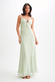 Fairytale summer.The SAIRA Chiffon Maxi Dress is a breathtakingly elegant piece designed to make a statement. This dress features a delicate ruffle neckline and a chic front keyhole, adding a touch of sophistication. The side panels at the hips with skirt pleating create a beautiful silhouette, while the flared hem adds a graceful flow. The maxi length ensures a stunning presence, and the adjustable straps provide a perfect fit. Fully lined for comfort, the Saira Chiffon Maxi Dress is perfect fo Pastel Ruffle Dress, Pastel Green Dress, Capsule Wardrobe Accessories, Dress Pastel, European Summer Outfits, Pastel Dress, Green Pastel, Beautiful Silhouette, Maxi Dress Sale