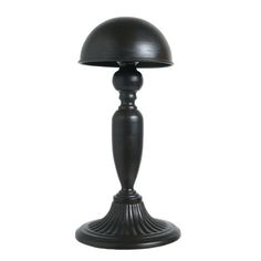 a black table lamp on a white background with clippings to the top and bottom