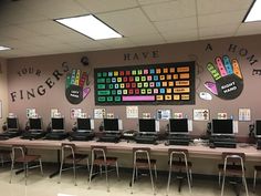 a classroom with computers on the desks and posters on the wall above them that say, you can have hope