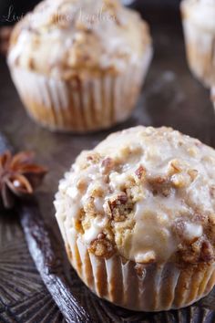 a muffin with white icing and cinnamon on top