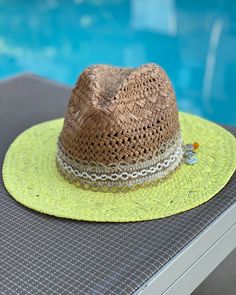 These are one of a kind Panama Hats! Featuring a hand painted brim, a unique and delicate hat ribbon, finished with cute little charms to brighten your day! The hat is constructed from 100% paper styled in a patterned weave accent. So super cute for the pool, the beach, bbq's, wine tasting, happy hour and more!! Makes a very special gift as well.Approx Measurements:Circumference: 22"Crown Height: 5.25"Brim: 3"100% Recycled Paper Adjustable Green Fedora For Spring, Playful Adjustable Brimmed Straw Hat, Whimsical Beach Hat For Spring, Playful Adjustable Wide Brim Straw Hat, Whimsical Adjustable Straw Hat For Summer, Summer Brimmed Hat As Gift, Summer Brimmed Hat As A Gift, Whimsical Curved Brim Sun Hat For Beach, Handmade Whimsical Sun Hat For Summer