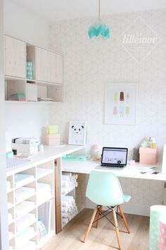 a laptop computer sitting on top of a white desk next to a chair and shelves