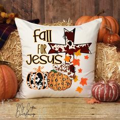 a pillow that says fall for jesus with pumpkins