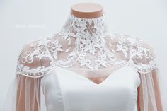 Handmade romantic lace bridal cape by yours truly. This bridal cape can be worn as many styles as you wish Color : Light Ivory Details: High collar Cape length 50cm/ 20in Back closing with button Materials :tulle, Rhinestone, crystal, pearl Standard size: Neck: 32-35cm Shoulder:36-40cm Bigger size (10 Neck: 36-41cm Shoulder: 41-45cm Shop other BRIDAL CAPES here : http://etsy.me/2zd6PZj Turnaround time: Due to the delicate nature of the handcrafted goods we produce this cover up has creation time Fitted Capelet With Cape Sleeves For Wedding, Lace Wedding Cape, Wedding Dress Capelet, Wedding Bodysuit, Bridal Capes, Bridal Bodysuit, Bridal Capelet, Cape Wedding Dress, Wedding Shrug