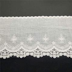 white lace on black background with space for text