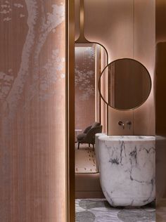 a marble bathtub in the corner of a room with mirrors and lights on it