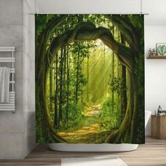 a bathroom with a shower curtain that has an image of a forest scene on it