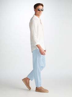 Our Sydney trousers in light blue are cut for a regular fit with a slight taper at the ankle for the perfect, warm weather ready style. We have developed a mid-weight, beautifully soft and breathable pure linen that will keep you cool and comfortable in even the hottest of conditions. This made in Italy fabric is finished by being piece-dyed before construction for a rich light blue. The Sydney trouser features a curved back yoke for a great fit and an elasticated waistband with drawcord for com Spring Light Wash Pants With Straight Hem, Classic Tapered Leg Light Wash Bottoms, Classic Light Wash Tapered Leg Bottoms, Light Wash Pants With Straight Hem For Spring, Classic Light Wash Pants For Spring, Classic Light Wash Cropped Pants, Light Wash Straight Hem Spring Pants, Spring Light Wash Straight Hem Pants, Classic Blue Summer Pants