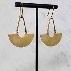 "Minimal earrings with brushed-brass crescents swinging below curved bars. These are simple, but make a beautiful statement. Coordinating necklace also available (pictured). ► DETAILS: Dimensions: 2.25\" from top to bottom x 1 3/8\" wide (5.5 x 3.5 cm) Materials: Raw brass components, brass hooks (nickel free) Packaging: Arrives in a cute box for safe shipping and gift-giving ► ALL OF MY JEWELRY: SPARKLEFARM.etsy.com ► SHIPPING: Shipping is FREE in the US! I ship within 3 business days and a tra Modern Crescent Brass Earrings, Everyday Crescent Brass Earrings, Brass Hooks, Earrings Minimal, Crescent Earrings, Minimal Earrings, Brass Hook, Cute Box, Minimal Art