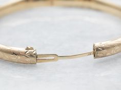 The details on this vintage 14-karat gold bangle are simply stunning! Intricate scrolling botanical designs are engraved in warm yellow gold, covering the entire bracelet. Beautiful on its own or layered with other bracelets this piece is perfect for day or evening wear.Metal: 14K Yellow GoldWidth: 6.3 mmInside Circumference: 6 1/2 InchesMarks: "JW 14K" Stamped on the inside band Etched Yellow Gold Bracelet For Anniversary, Classic Etched Yellow Gold Bracelet, Elegant Etched Yellow Gold Cuff Bracelet, Elegant Etched Yellow Gold Bangle, Victorian 14k Yellow Gold Bangle, Victorian Style 14k Yellow Gold Bangle, Elegant Etched Cuff Bracelet, Elegant Engraved Gold Bangle Bracelet, Elegant Engraved 14k Gold Cuff Bracelet