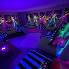 a room filled with couches covered in neon lights