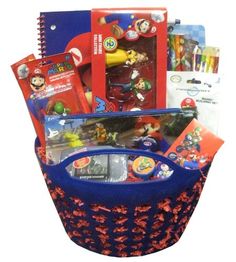 a blue basket filled with lots of toys and books on top of a white surface