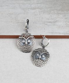 Wise Owl Dangle Drop Earrings 925 Sterling Silver with Clear Cubic Zirconia CZ Gemstones Artisan Crafted Vintage Inspired Material: 925 Sterling Silver Clear Cubic Zirconia CZ Gemstones Earrings Length: 1.60 inches Width: 0.90 inches Closure: Lever back Matching pendant is available https://www.etsy.com/listing/1027110377/wise-owl-pendant-necklace-925-sterling?ref=listings_manager_grid Comes with a gift pouch and box Free Domestic Shipping It is a gift that will create memories for years to come White Gold Metal Earrings For Gifts, Sterling Silver Drop Clip-on Earrings For Gift, Fine Jewelry Metal Earrings As Gift, Fine Jewelry Metal Earrings For Gift, Fine Metal Earrings As Gift, Nickel Free Sterling Silver Clip-on Earrings, Sterling Silver Pendant Earrings As A Gift For Her, Nickel-free Silver Clip-on Earrings, Silver Sterling Silver Dangle Clip-on Earrings