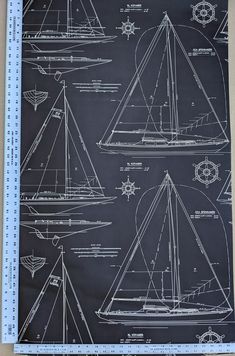 a blueprinted drawing of sailboats on a blackboard with white outlines