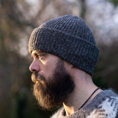 ♦ This fisherman style hat has been made with original Soft Donegal Merino Tweed. This unisex hat is ribbed and has a double folded brim. ♦ This hat / beanie is unisex and will fit most adult heads 55 - 60 cm in diameter. ♦ Materials: 100% Soft Donegal merino tweed ♦ Measurements (approx. and laid flat):     height (with double brim unfolded): 38 cm / 15 inches      ♦Care instructions: Handwash at 30oC with gentle wool wash and lay flat to dry. ♦ SHIPPING: All items are shipped with Registered/T Warm Short Brim Beanie For Fall, Ribbed Winter Hat For Outdoor, Winter Outdoor Ribbed Hat, Ribbed Wool Hat For Fall, Classic Knitted Hats For Outdoor, Knitted Wool Beanie Cap, Wool Beanie For Outdoor Use, Fall Ribbed Wool Hat, Wool Knitted Beanie Cap