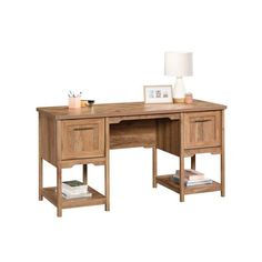 a wooden desk with two drawers and a lamp