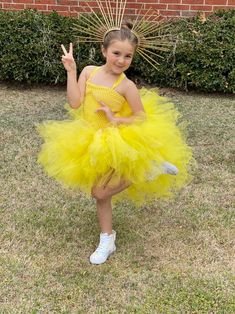 This sun costume dress will be fire for any celebration. Not like any costume that you would find in a store. It is super poofy. She will feel like a star and twirl everywhere. The yellow crochet top is lined, making it soft and not see-through! The dress is made with yellow tulle with sequins throughout making it extra sparkly. This is a high-low dress with the tulle being layered and floor length in the back. 2 yellow ribbons cross cross and tie in the back for a secure fit. Sun headband is no Yellow Princess Style Dress For Costume Party, Yellow Princess Dress For Dress-up, Fitted Yellow Princess Dress For Dress-up, Yellow Fitted Princess Dress For Dress-up, Yellow Princess Dress For Costume Party, Fitted Yellow Princess Dress For Fancy Dress, Fitted Yellow Princess Dress For Party, Princess Style Tutu Dress For Summer Costume Party, Yellow Summer Party Tutu Dress