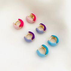 A pair of cute and colorful enamel chunky hoops. These two-tone huggie hoops are perfect for the summer and to give your outfit an extra pop of color. Please keep in mind the diameter of these huggies as they are fairly small and might not fit all earlobes! ⭐️Item Description: Size: 13 x 6mm Diameter: 7mm Benefits: Water & Tarnish Resistant, Hypoallergenic ⭐️About Our Earrings: Our earring collection ranges in styles to choose from. It contains the perfect earrings to complement and highlight th Pink Enamel Hoop Earrings, Trendy Pink Huggie Earrings, Enamel Hoop Earrings, Trendy Pink Enamel Earrings, Multicolor Huggie Hoop Earrings For Gift, Trendy Enamel Huggie Earrings, Multicolor Enamel Hoop Earrings, Multicolor Huggie Earrings For Gift, Multicolor Huggie Earrings As Gift