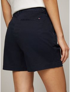 Tommy Hilfiger women's short. Made from soft, stretch fabric and cut in an easy fit, our go-to short is comfortable and flattering.  Material: 77% Cotton, 20% Reprocessed Cotton, 3% Elastane. Solid Color Relaxed Fit Bermuda Shorts, Relaxed Fit Solid Bermuda Shorts, Casual Mid-rise Bottoms By Tommy Hilfiger, Solid Bermuda Shorts For Work, Cotton Mid-rise Shorts For Workwear, Casual Stretch Workwear Shorts, Casual Bermuda Shorts For Work, Tommy Hilfiger Casual Short Length Bottoms, Casual Tommy Hilfiger Spring Shorts