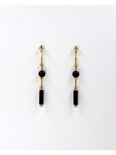 These long, dangle earrings feature polished onyx stone.  The geometric cut of the stone and brass elements creates a modern and minimalistic design while the variation in shapes adds detail and interest. The deep black of the onyx stone and the warm, metallic tone of the brass highlights the materials and creates contrast.  The earrings are finished with brass ball stud with stainless steel earring post.  Onyx is a semi precious gemstone known for its striking black color and smooth, glossy app Minimalist Black Drop Earrings, Minimalist Black Linear Drop Earrings, Minimalist Black Long Drop Earrings, Modern Black Long Drop Jewelry, Minimalist Black Linear Earrings For Gifts, Minimalist Black Linear Earrings As Gift, Modern Onyx Drop Earrings, Set Theory, 1920s Jewelry