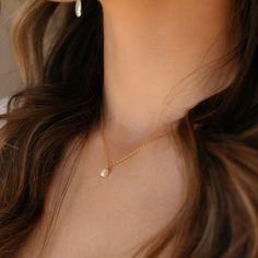 Featuring a delicate pearl and classic gold chain, this timeless piece adds a bit of romantic charm to your look. It's the perfect necklace to make your day just a little more special! DETAILSOffered in 14", 16", or 18" lengths, Gemstone measures at 0.25"Available in 14k Gold Fill and Sterling SilverHypoallergenic and nickel freeWe recommend removing pearls before showering, swimming or sleeping to keep them shining bright Dainty Pearl Necklace With Pearl Charm For Everyday, Classic Gold Charm Necklace With Pearl Drop, Classic 14k Gold Filled Necklaces With Pearl Charm, Classic 14k Gold-filled Necklaces With Pearl Charm, Delicate Pearl Charm Chain Necklace Gift, Everyday Delicate Chain Necklace With Pearl Pendant, Dainty Pearl Charm Chain Necklace As Gift, Dainty Everyday Pearl Necklace With Pendant, Dainty Charm Necklace With Pearl Chain For Gift