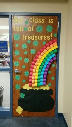 a door decorated with sticky notes and a rainbow in the middle that says our class is out of treasures