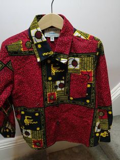 Long sleeve Boys formal shirt in an African Ankara Christmas print. Available from sizes 6 months to 6 years. Red Long Sleeve Top For Gifts, Red Printed Party Set, Red Fitted Top For Birthday, Fitted Red Top For Birthday, Holiday Festive Long Sleeve Shirt, Cotton Long Sleeve Sets For Birthday, Long Sleeve Cotton Set For Birthday, Printed Long Sleeve Shirt For Party, Red Collared Shirt For Party