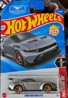 a hot wheels car is on display for sale