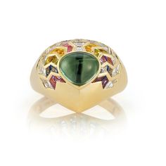 Behold the captivating elegance of our Wishing Well Shield Ring in Feather. Crafted to perfection Luxury Tourmaline Rings, Luxury Tourmaline Emerald Ring, Luxury Tourmaline Cabochon Rings, Luxury Multi-stone Tourmaline Ring, Luxury Multi-stone Sapphire Ring With Tourmaline, Luxury Polished Tourmaline Rings, Symbols Of Hope, Zig Zag Ring, Wishing Wells