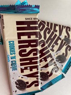 three bars of chocolate covered in blue foil on top of each other with the word hershey's printed on them