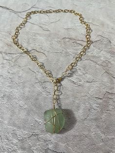 "Beautiful, ocean tumbled light aqua/light green seaglass necklace. Created with 14k gold filled wire, clasp and chain. Chain measures 19\" long. Front clasp design, may be worn as a lariat too! Wear a gem from the sea!" Light Aqua, Sea Glass Necklace, Glass Necklace, Sea Glass, Wire Wrapping, Gold Filled, Necklace Etsy, Gems, Jewelry Necklaces