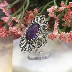 925 Sterling Silver Genuine Purple Amethyst Artisan Crafted Filigree Cocktail Statement Ring Women Jewelry Gift Boxed Material: 925 Solid Sterling Silver Genuine Purple Amethyst Gemstone Dimensions : 14 mm x 7 mm, Approximate Total Carat Weight: 3.4 Ring Face Length: 1. 4 inches Width: 0.88 inches Nickel free This will come in a designer pouch & gift box with a romance card Free Domestic Shipping It is a gift that will create memories for years to come. Our fine silver jewelry is Made in our Sterling Silver Purple Jewelry With Intricate Design, Purple Sterling Silver Jewelry With Intricate Design, Sterling Silver Jewelry With Intricate Design In Purple, Sterling Silver Amethyst Ring With Intricate Design, Oval Sterling Silver Amethyst Ring With Intricate Design, Spiritual Sterling Silver Amethyst Ring, Oval Amethyst Ring In Sterling Silver With Intricate Design, Oval Amethyst Ring With Intricate Design In Sterling Silver, Silver Amethyst Ring With Accent Stones As Gift