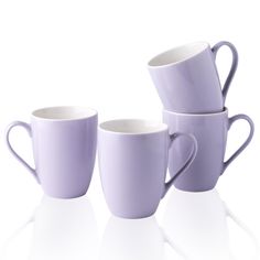 three purple coffee cups sitting next to each other