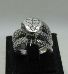 Sterling silver ring 925/1000, huge snake. Stamped 925. Approximate weight 19.4 grams. Width 1.8cm. All our jewels are made from solid sterling silver 925/1000 and are carefully crafted by hand in our family workshop. We dispatch your orders in 5 working days, worldwide and the postage is $5. We ship registered priority mail. Please allow 5-7 working days for delivery in Europe and 10-15 working days outside Europe. For any questions - please do not hesitate to contact me! Sterling Silver Snake-shaped Rings, Silver Snake-shaped Ring For Formal Occasions, Silver Snake Ring For Formal Occasions, Silver Sterling Snake-shaped Ring, Silver Engraved Snake Ring Collectible, Engraved Silver Snake Ring, Unique Engraved Silver Snake Ring, Engraved Silver Snake Ring Collectible, Unique Hallmarked Snake Ring For Formal Occasions