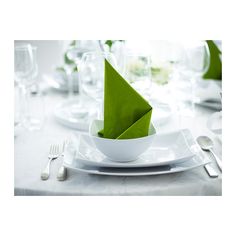 a white plate topped with a green napkin