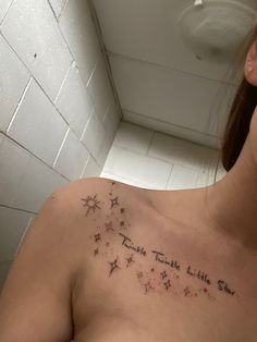 a woman with a star tattoo on her chest